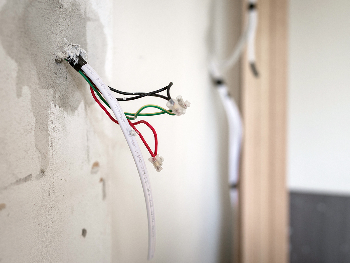 Traditional switch rewiring with exposed wall wiring during an Australian home renovation